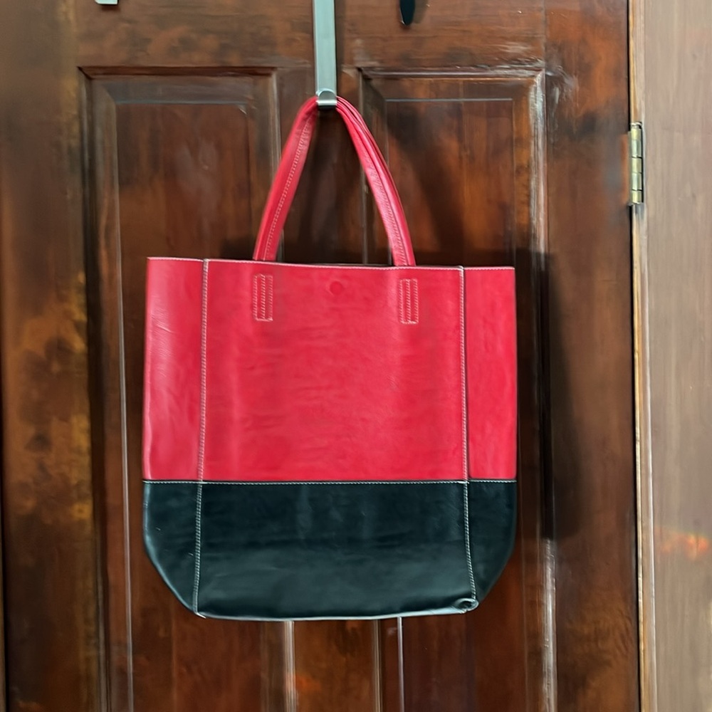 Imported red/black leather tote.
